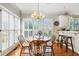 Cozy breakfast nook with natural lighting, hardwood floors, and a chandelier at 2845 Burgundy Dr, Cumming, GA 30041