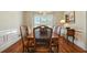 Charming dining area featuring a chandelier and shuttered windows for natural light at 2845 Burgundy Dr, Cumming, GA 30041