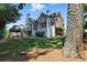 Beautiful home with a spacious lawn, mature trees, and well-maintained landscaping at 2845 Burgundy Dr, Cumming, GA 30041
