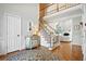 Spacious foyer with hardwood floors, staircase, and view of the living room at 2845 Burgundy Dr, Cumming, GA 30041