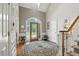 Grand foyer with high ceilings, leaded glass entry door, and elegant staircase at 2845 Burgundy Dr, Cumming, GA 30041