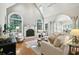 Bright living room with fireplace, vaulted ceiling, and open floor plan at 2845 Burgundy Dr, Cumming, GA 30041