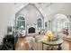 Vaulted living room with fireplace, large windows, and hardwood floors at 2845 Burgundy Dr, Cumming, GA 30041