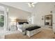 Spacious main bedroom featuring a high vaulted ceiling, sitting area, and neutral decor at 2845 Burgundy Dr, Cumming, GA 30041