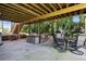 This outdoor patio has a seating area, a hammock, stairs to the deck, and wooded scenery at 2845 Burgundy Dr, Cumming, GA 30041