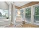 Bright sitting room with bay window, neutral decor, and adjacent spa tub at 2845 Burgundy Dr, Cumming, GA 30041