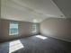 Bright bedroom with vaulted ceilings, cozy carpeting and natural light pouring in from two windows at 4189 Post Oak Grv, Atlanta, GA 30349