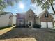 Beautiful two-story home with brick facade, bay window, and attached two-car garage at 4189 Post Oak Grv, Atlanta, GA 30349