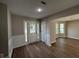 Inviting foyer with new hard surface flooring and natural light streaming through the sidelight windows at 4189 Post Oak Grv, Atlanta, GA 30349