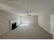 Spacious living room with fireplace, neutral carpeting, and plenty of natural light at 4189 Post Oak Grv, Atlanta, GA 30349