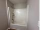 Bathroom shower featuring updated fixtures, with clean lines and neutral paint color at 4189 Post Oak Grv, Atlanta, GA 30349