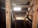 Basement stairs lead to a small window, providing a minimal amount of natural light at 1373 Lucile Sw Ave, Atlanta, GA 30310