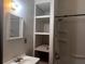 Bathroom featuring white vanity, tub/shower combo and built in shelving at 1373 Lucile Sw Ave, Atlanta, GA 30310