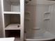 Bathroom showing shower/tub combo with built-in shelving at 1373 Lucile Sw Ave, Atlanta, GA 30310