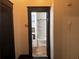 Bathroom view through a doorway featuring a tub/shower combo and built in shelving at 1373 Lucile Sw Ave, Atlanta, GA 30310