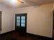 Bright room features dark trim and wood floors, showcasing glass panel doors at 1373 Lucile Sw Ave, Atlanta, GA 30310