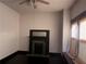 View of the bedroom with hardwood floors, a fireplace, and a large window at 1373 Lucile Sw Ave, Atlanta, GA 30310