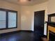 View of the bedroom with hardwood floors, a fireplace, and a large window at 1373 Lucile Sw Ave, Atlanta, GA 30310