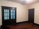 Bright room features dark trim and wood floors, showcasing glass panel doors at 1373 Lucile Sw Ave, Atlanta, GA 30310