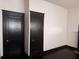 View of the bedroom with hardwood floors and two doors at 1373 Lucile Sw Ave, Atlanta, GA 30310