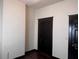 This is an interior picture of a bedroom with white walls and black trim and doors at 1373 Lucile Sw Ave, Atlanta, GA 30310