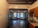 This is a kitchen with a black trim doorway and a stainless steel sink in wood cabinets at 1373 Lucile Sw Ave, Atlanta, GA 30310