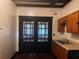 Kitchen features stainless steel appliances, wood cabinets and decorative glass panel doors at 1373 Lucile Sw Ave, Atlanta, GA 30310