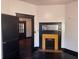 View of the living room with hardwood floors, a fireplace, and doorway to the next room at 1373 Lucile Sw Ave, Atlanta, GA 30310
