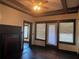 View of the living room with hardwood floors, a fireplace, ceiling fan, and large windows at 1373 Lucile Sw Ave, Atlanta, GA 30310