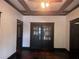 Elegant living room with coffered ceilings, dark trim, and hardwood floors at 1373 Lucile Sw Ave, Atlanta, GA 30310