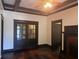 Comfortable living room featuring a fireplace, ceiling fan and glass paneled doors at 1373 Lucile Sw Ave, Atlanta, GA 30310