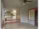 Covered front porch with railings, ceiling fan, and views of the surrounding neighborhood at 1373 Lucile Sw Ave, Atlanta, GA 30310