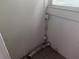 This room has white paneled walls, an outlet and a silver hose at 1373 Lucile Sw Ave, Atlanta, GA 30310