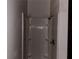 Close-up of a shower with white surround, basic shower head, and molded shelves at 1373 Lucile Sw Ave, Atlanta, GA 30310