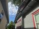 The side of the house is blue with red window trim and the sky is visible between houses at 1373 Lucile Sw Ave, Atlanta, GA 30310
