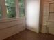 Cozy sunroom with multiple windows, wainscoting, and tile flooring at 1373 Lucile Sw Ave, Atlanta, GA 30310