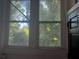 This is a picture of the view from a paneled window with a black door frame at 1373 Lucile Sw Ave, Atlanta, GA 30310