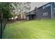 Large backyard with a well maintained lawn and a two-story deck at 2333 Wilkins Cv, Decatur, GA 30035