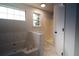 Well-lit bathroom with a soaking tub, separate shower, and marble floors at 2333 Wilkins Cv, Decatur, GA 30035