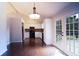 Bright dining area featuring dark hardwood floors, fresh paint, and double doors leading to the deck at 2333 Wilkins Cv, Decatur, GA 30035