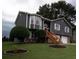 Charming two-story home with gray siding, stone accents, well-maintained lawn, and inviting curb appeal at 2333 Wilkins Cv, Decatur, GA 30035