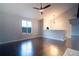 Living room featuring hardwood floors, a fireplace, and a large window at 2333 Wilkins Cv, Decatur, GA 30035