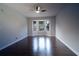 This living room offers hardwood flooring, neutral paint, a ceiling fan, and a bay window at 2333 Wilkins Cv, Decatur, GA 30035