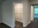Walk in closet featuring shelving with a view of the carpeted bedroom at 3383 Milan Ct, Douglasville, GA 30135