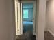 Hallway with views of the carpeted bedroom and outdoor scenery at 3383 Milan Ct, Douglasville, GA 30135