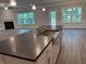 Modern kitchen with stainless steel appliances, granite countertops, and a large island at 3383 Milan Ct, Douglasville, GA 30135