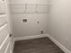 Practical laundry room with luxury vinyl plank flooring and washer and dryer hookups at 3383 Milan Ct, Douglasville, GA 30135
