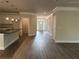 Open living space featuring wood-look floors, recessed lighting, and an eat-in kitchen space at 3383 Milan Ct, Douglasville, GA 30135