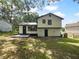 Two-story home with fenced backyard and mature trees at 3867 Cherie Glen Rd, Snellville, GA 30039