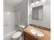 Bathroom featuring tub, shower, granite countertop, and vanity mirror at 3867 Cherie Glen Rd, Snellville, GA 30039